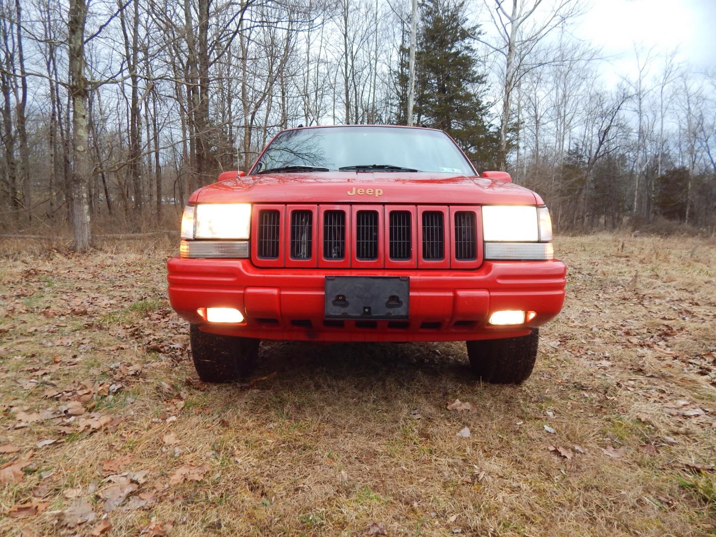 1996 RED /Tan Leather Jeep Grand Cherokee Limited 4WD (1J4GZ78Y6TC) with an 5.2L V8 OHV 16V engine, 4-Speed Automatic Overdrive transmission, located at 6528 Lower York Road, New Hope, PA, 18938, (215) 862-9555, 40.358707, -74.977882 - Here we have a 1996 Jeep Grand Cherokee with a 5.2L V8 putting power to a 4x4 automatic transmission. Options include: tan leather with wood trim, heat/AC, AM/FM/CD/TAPE radio, tilt steering wheel, cruise control, heated front seat, moon roof, power windows/locks/mirrors, roof rack, fog lights, tow - Photo#7